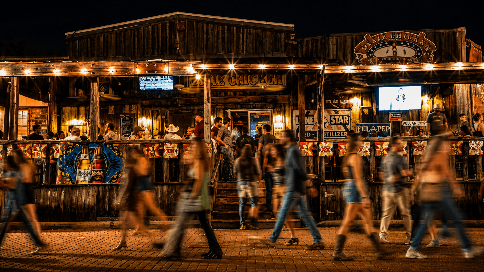 Dixie Chicken bar at night on the Northgate District, College Station TX
